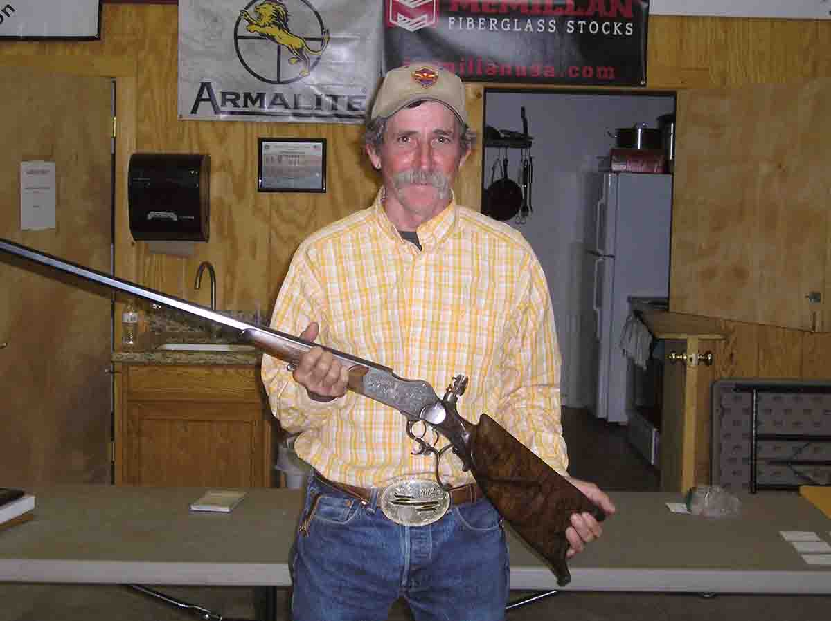 Chip Mate with the Dan Theodore National Championship Ironman prize rifle.